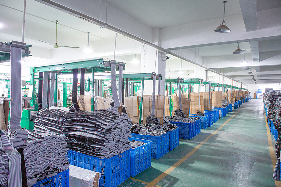 Workshop area with weatherstrip materials sorted in blue bins