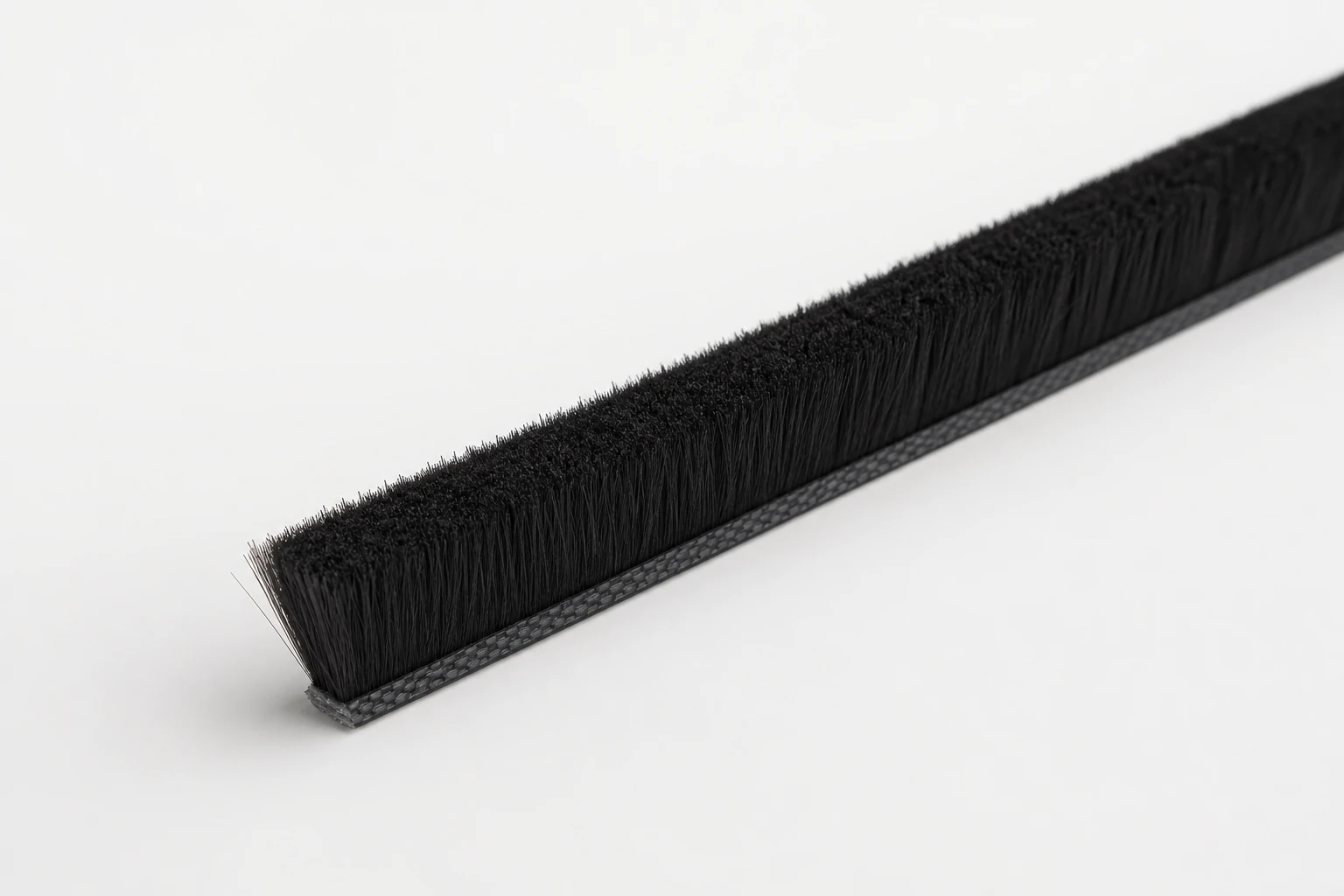 Sliding window brush seal pile weatherstrip for aluminum window tracks